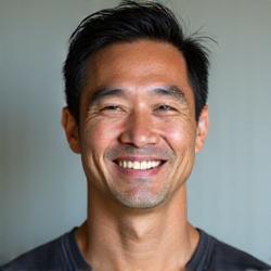 Headshot of David Chen, a certified Aura Bloom wellness coach.